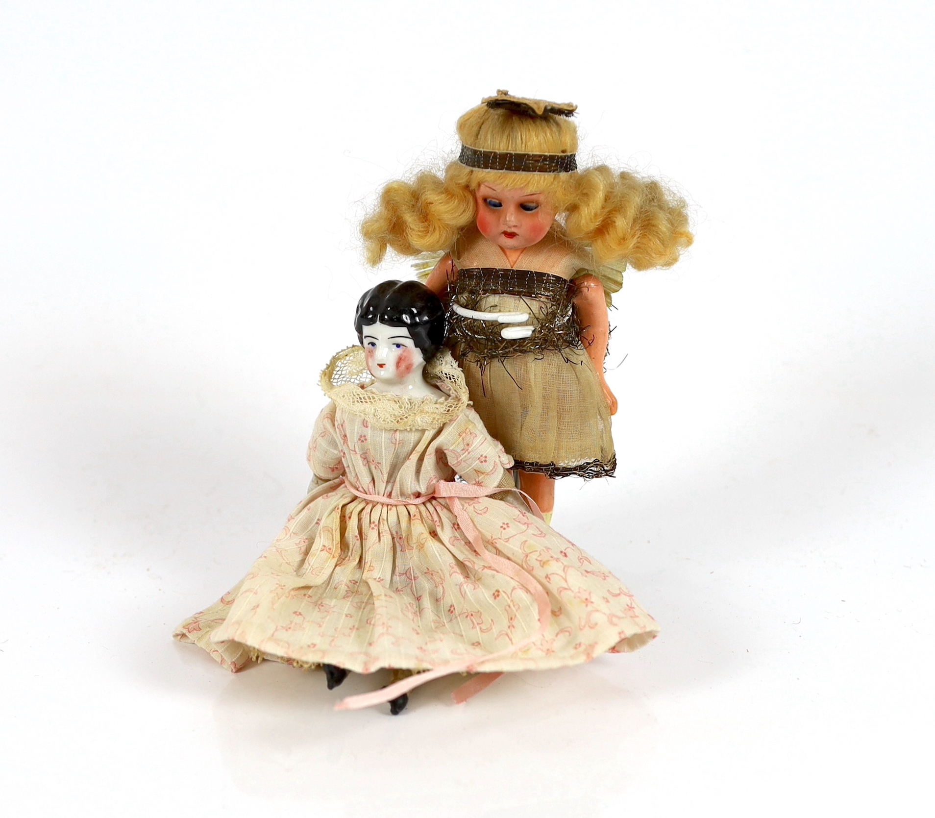 A composition fairy doll, c.1920m 15cm, with a china headed doll on soft body with bisque boots, c.1870, 15cm